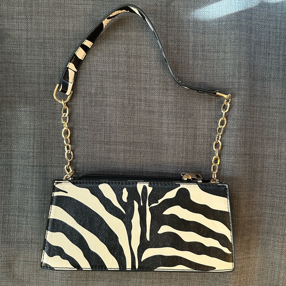 Zebra white and black shoulder bag with gold hardware
